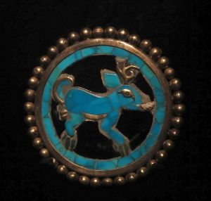 Turquoise and gold brooch found in Moche tomb